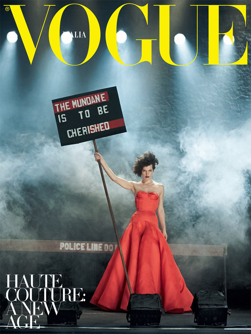 Illustration for article titled Incredibly Lovely: Milla Jovovich marches with Jenny Holtzer slogans in a dystopian future